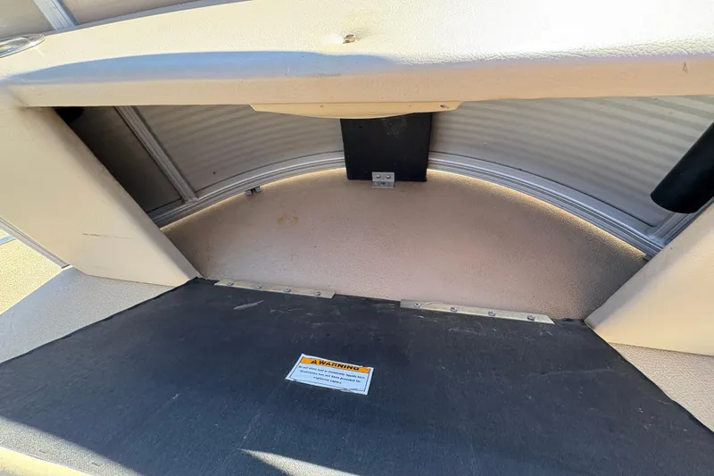 Slide: The Image of Interior view of a 2014 Godfrey Sweetwater 2086 F boat storage compartment. - 11