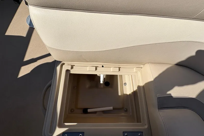Slide: The Image of 2014 Godfrey Sweetwater 2086 F boat seat storage compartment, open and empty. - 16