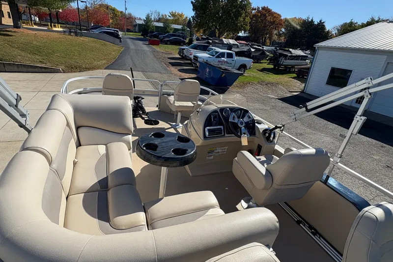 Slide: The Image of 2014 Godfrey Sweetwater 2086 F pontoon boat with beige seating and steering console. - 23