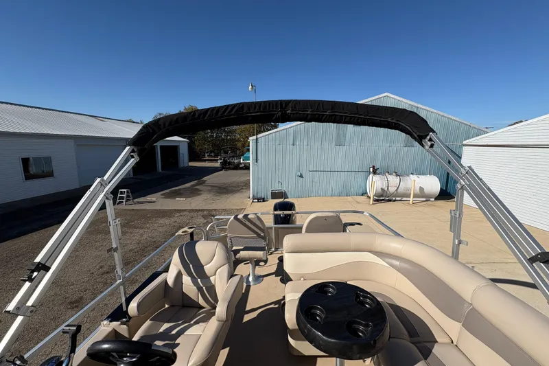 Slide: The Image of 2014 Godfrey Sweetwater 2086 F pontoon boat with beige seating and black canopy. - 25