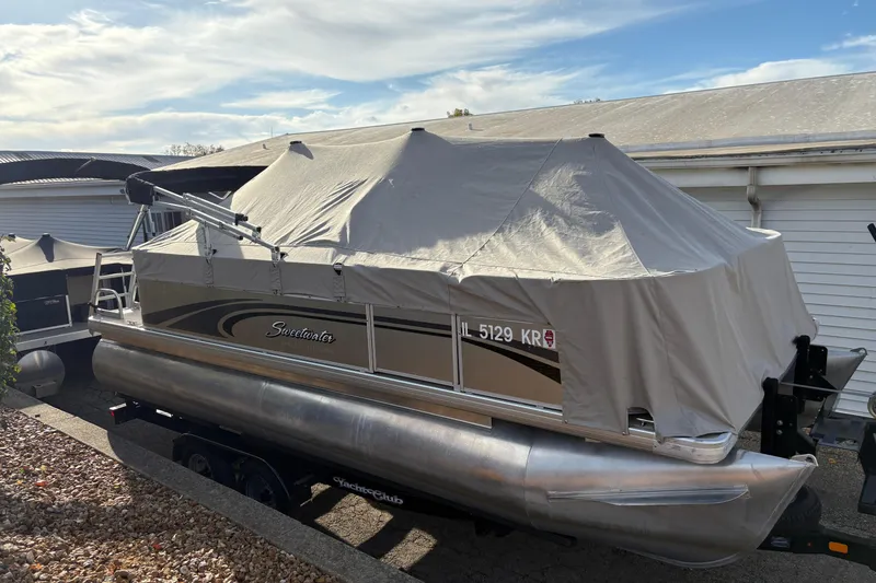 Slide: The Image of 2014 Godfrey Sweetwater 2086 F pontoon boat covered and parked outdoors. - 31