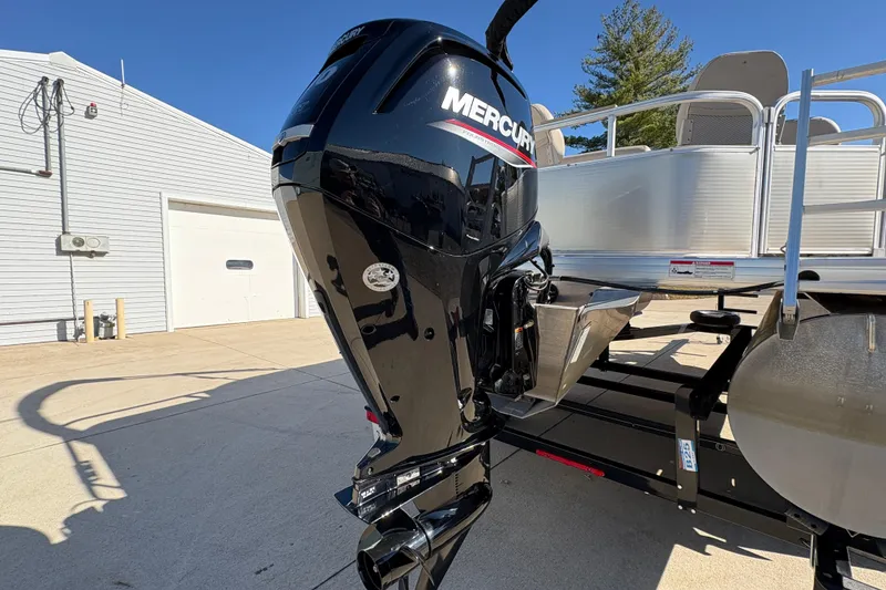 Slide: The Image of 2014 Godfrey Sweetwater 2086 F pontoon boat with Mercury outboard motor in a driveway. - 7