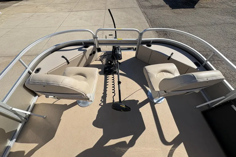 Slide: The Image of 2014 Godfrey Sweetwater 2086 F pontoon boat interior with beige seating and fishing setup. - 9