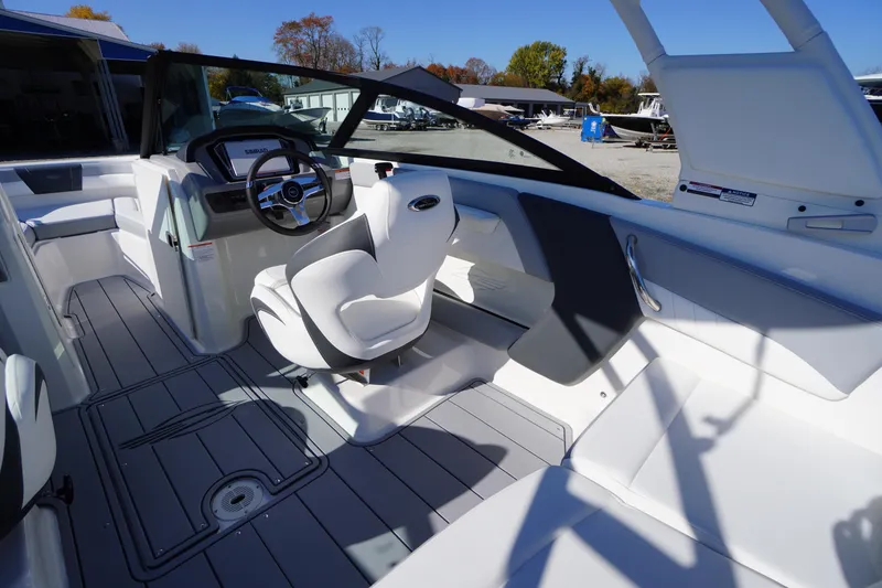 Slide: The Image of 2026 Chaparral 21 SSi OB boat interior with modern helm and seating. - 31