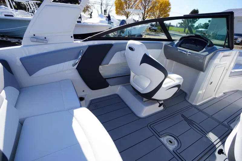 Slide: The Image of 2026 Chaparral 21 SSi OB boat interior with sleek seating and modern dashboard design. - 32