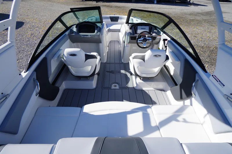 Slide: The Image of 2026 Chaparral 21 SSi OB boat interior with modern seating and steering console. - 35