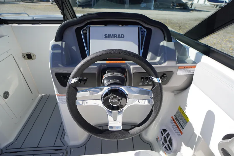 Slide: The Image of Steering wheel of 2026 Chaparral 21 SSi OB boat with Simrad display. - 19