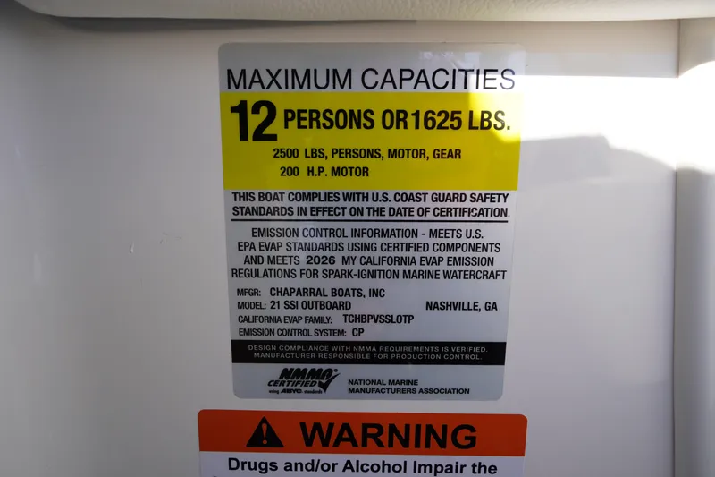 Slide: The Image of Chaparral 21 SSi OB 2026 boat capacity label, 12 persons or 1625 lbs, safety compliance. - 30
