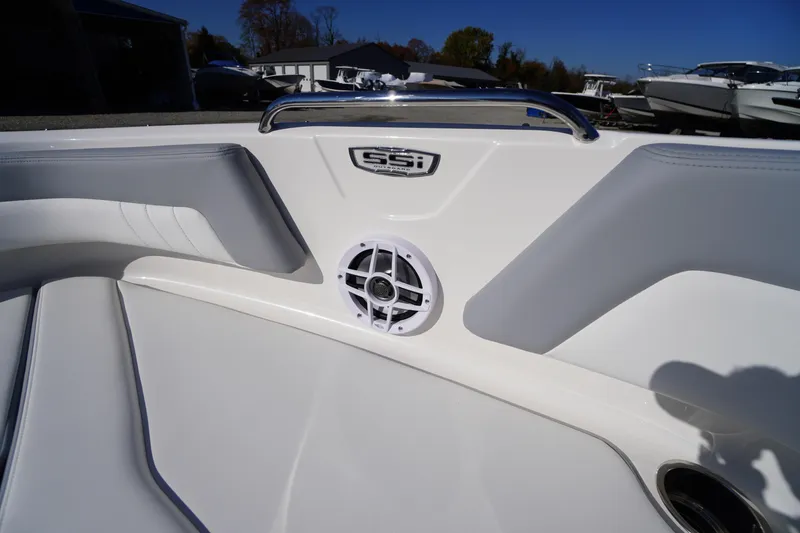 Slide: The Image of 2026 Chaparral 21 SSi OB boat interior with speaker and sleek seating design. - 7