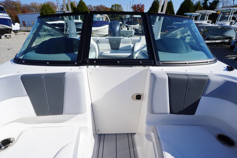 Slide: The Image of 2026 Chaparral 21 SSi OB boat interior with sleek seating and windshield. - 14