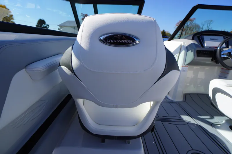 Slide: The Image of 2026 Chaparral 21 SSi OB boat interior with white seating and modern dashboard. - 33