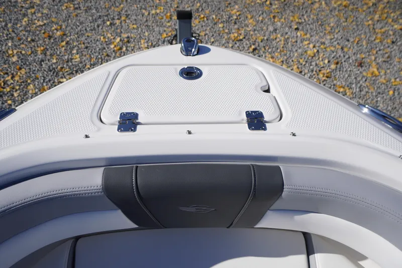 Slide: The Image of 2026 Chaparral 21 SSi OB boat bow with storage compartment and sleek seating design. - 4