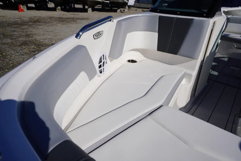 Slide: The Image of 2026 Chaparral 21 SSi OB boat interior with white seating and speaker. - 9