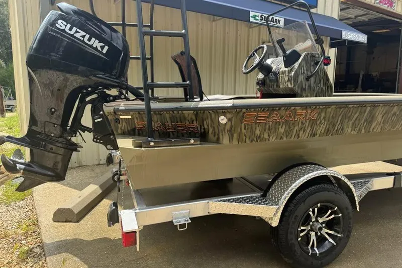 Slide: The Image of 2025 SeaArk Slayer Pro boat with Suzuki outboard motor on trailer. - 4