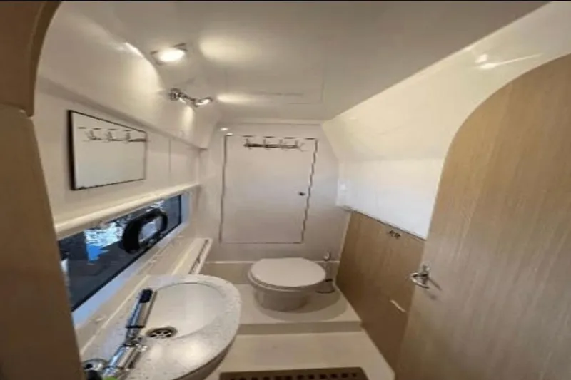 Slide: The Image of Modern bathroom interior of 2022 Aquila 36 Cruiser yacht, featuring sleek design and fixtures. - 11