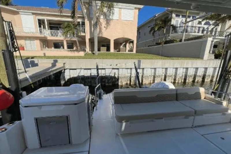 Slide: The Image of Aquila 36 Cruiser 2022 docked, featuring spacious seating and modern amenities. - 12