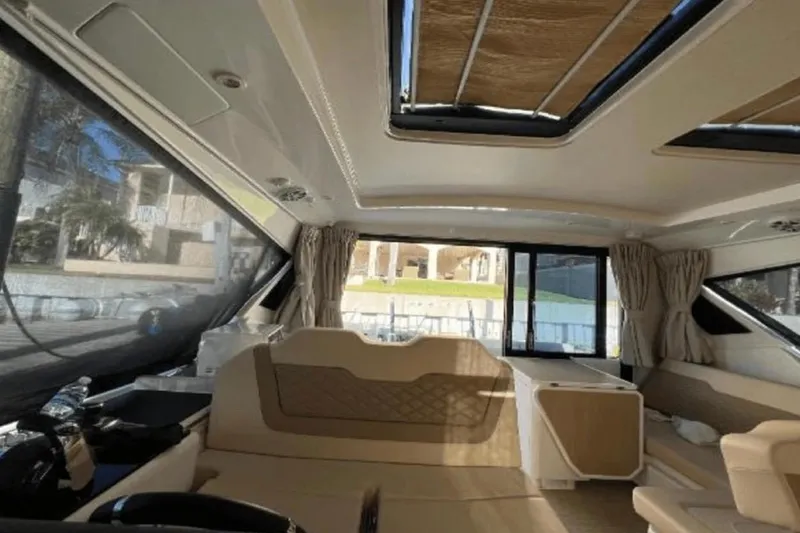 Slide: The Image of Interior of 2022 Aquila 36 Cruiser, featuring spacious seating and modern design elements. - 19