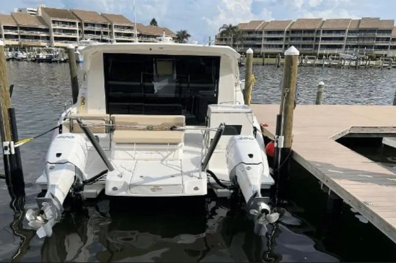 Slide: The Image of Aquila 36 Cruiser 2022 docked at marina with twin outboard engines. - 20