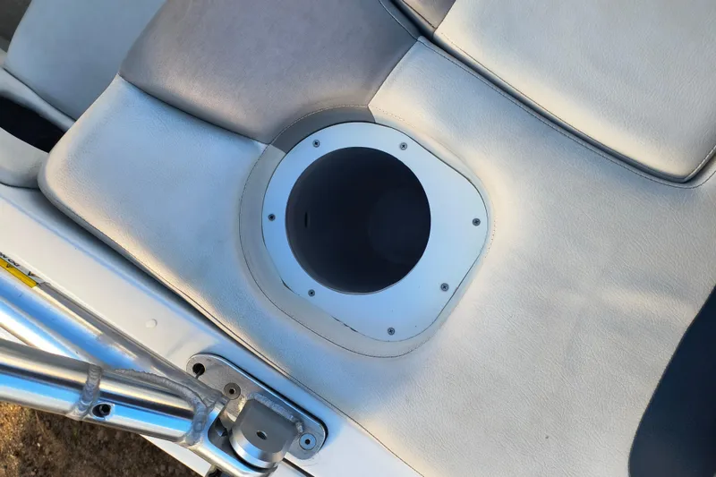 Slide: The Image of 2018 Rinker QX23 BR boat seat with integrated cup holder. - 24