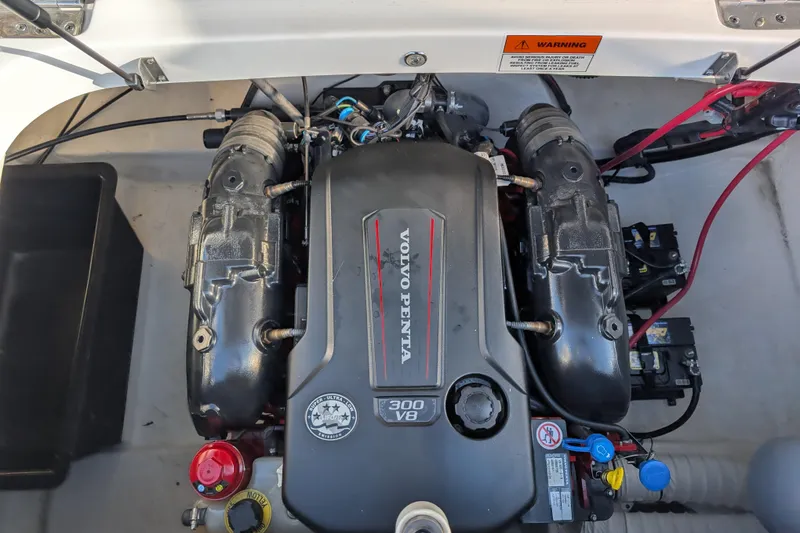 Slide: The Image of Engine compartment of a 2018 Rinker QX23 BR with Volvo Penta 300 V8 engine. - 29