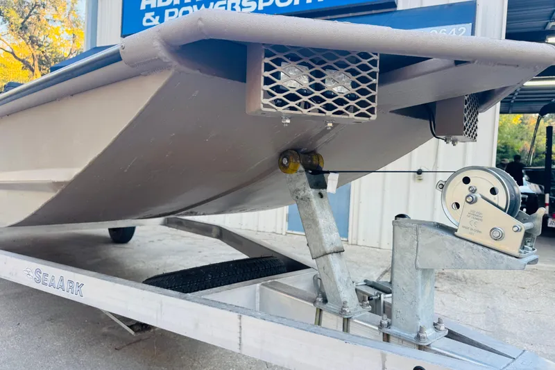 Slide: The Image of 2025 SeaArk Mud Runner 180 boat on trailer, close-up of hull and winch. - 18