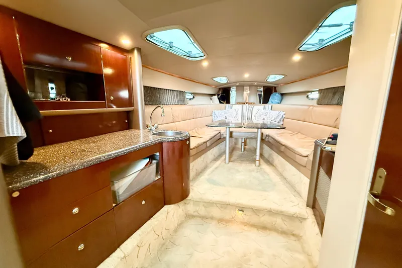 Slide: The Image of Luxurious interior of a 2004 Formula 400 Super Sport yacht with elegant seating and kitchenette. - 15