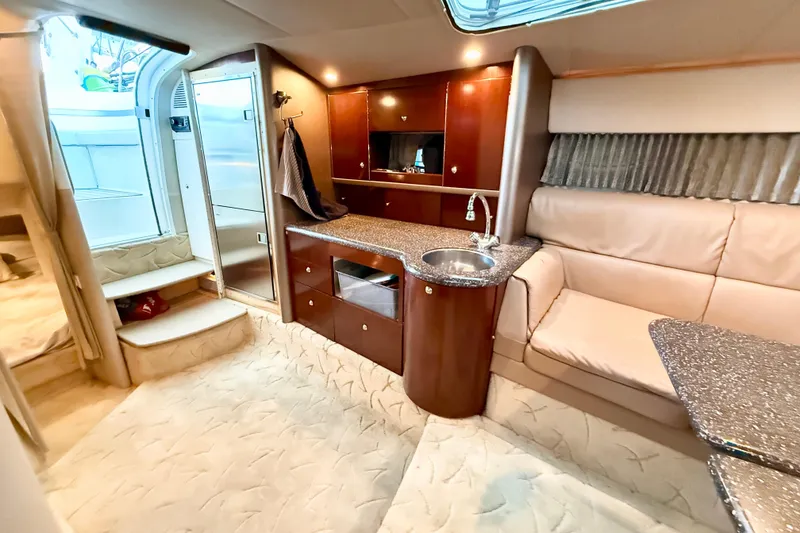 Slide: The Image of Luxurious interior of a 2004 Formula 400 Super Sport yacht with kitchenette and seating area. - 17