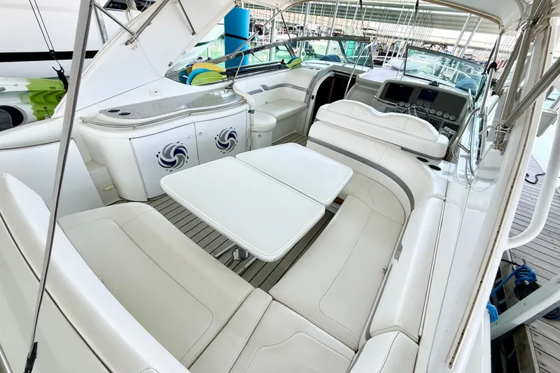 Slide: The Image of 2004 Formula 400 Super Sport yacht interior with white seating and modern dashboard. - 8