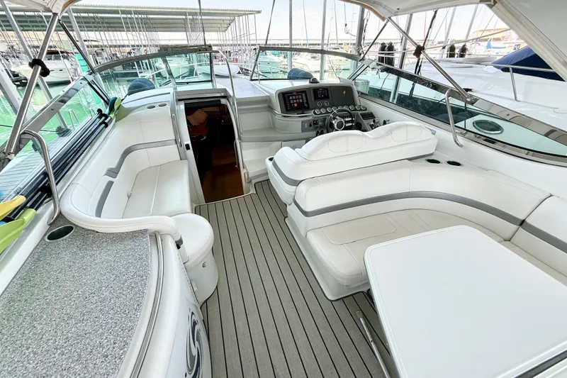 Slide: The Image of 2004 Formula 400 Super Sport yacht interior with white seating and modern dashboard. - 9