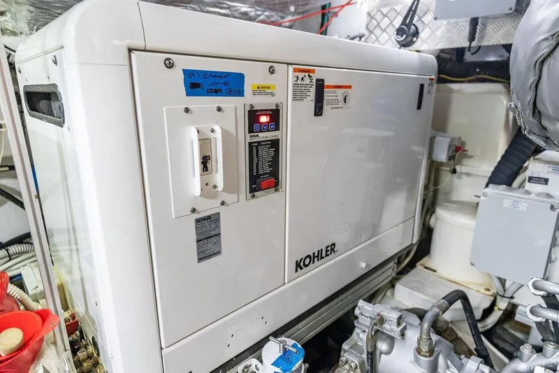 Slide: The Image of Engine room of 2019 Pershing 9X yacht featuring a Kohler generator. - 100