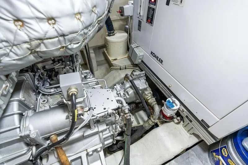 Slide: The Image of Engine room of 2019 Pershing 9X yacht featuring Kohler generator and mechanical components. - 101