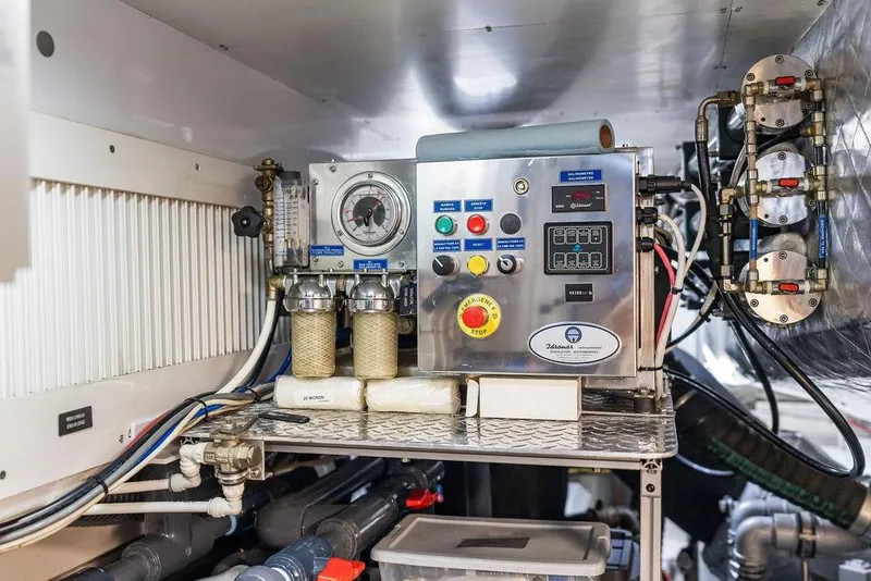 Slide: The Image of Engine room of 2019 Pershing 9X yacht with control panel and gauges. - 109