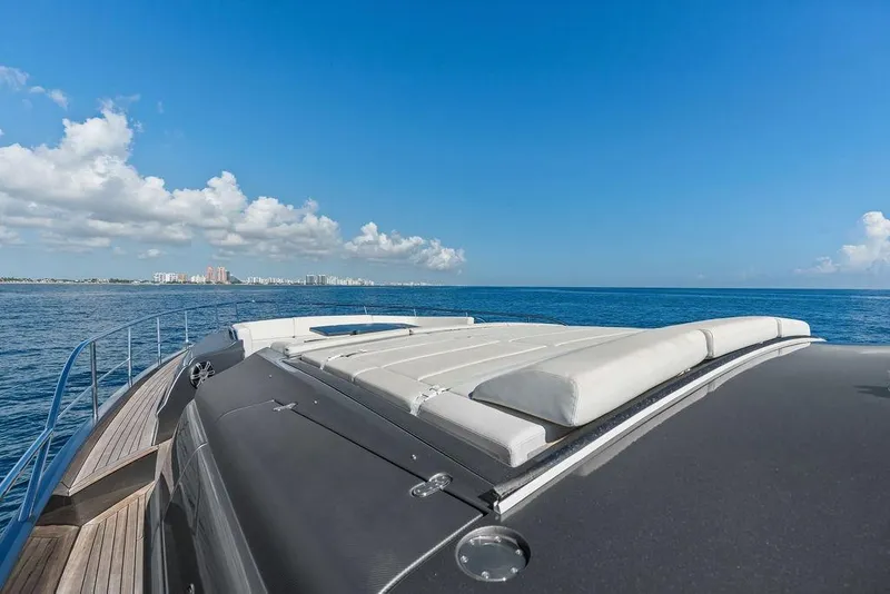 Slide: The Image of 2019 Pershing 9X yacht deck with ocean view and clear blue sky. - 12
