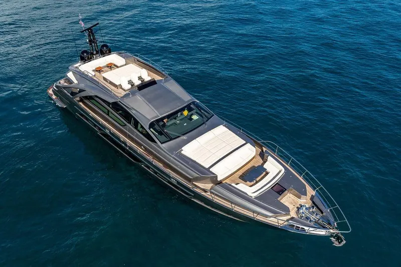 Slide: The Image of Luxurious 2019 Pershing 9X yacht cruising on open blue sea. - 16