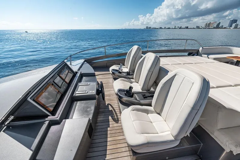 Slide: The Image of Luxurious 2019 Pershing 9X yacht deck with plush seating and ocean view. - 18