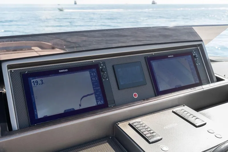 Slide: The Image of Control panel of a 2019 Pershing 9X yacht with navigation screens. - 21