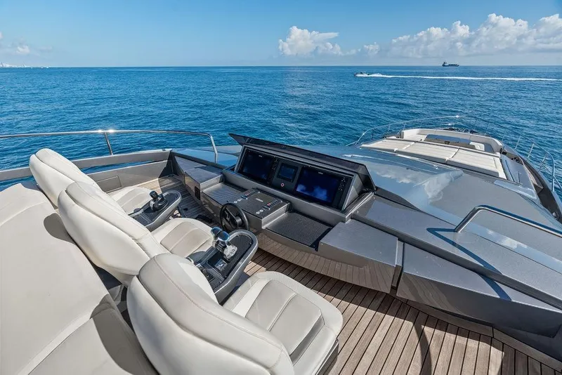 Slide: The Image of Luxurious 2019 Pershing 9X yacht helm with ocean view and modern controls. - 23