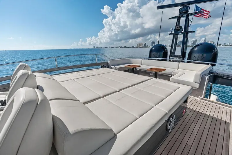 Slide: The Image of Luxurious 2019 Pershing 9X yacht deck with sun loungers and ocean view. - 24
