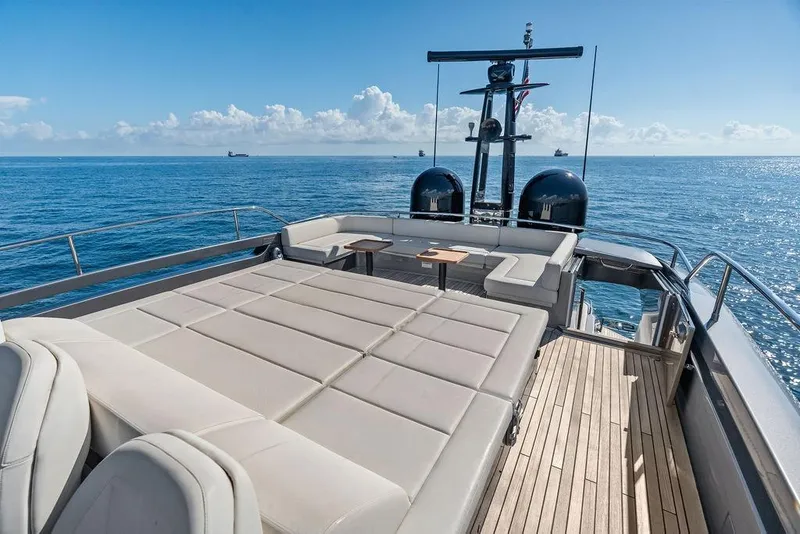 Slide: The Image of Luxurious 2019 Pershing 9X yacht deck with sun loungers and ocean view. - 26