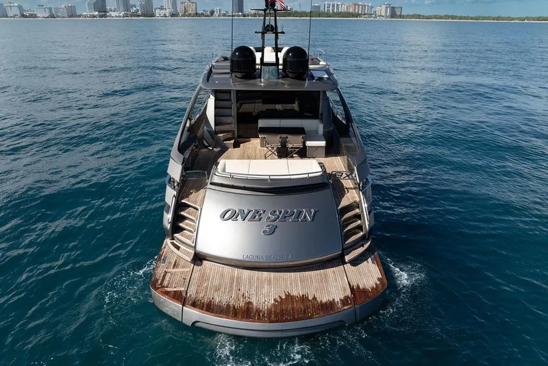 Slide: The Image of 2019 Pershing 9X luxury yacht on open water, city skyline in background. - 30