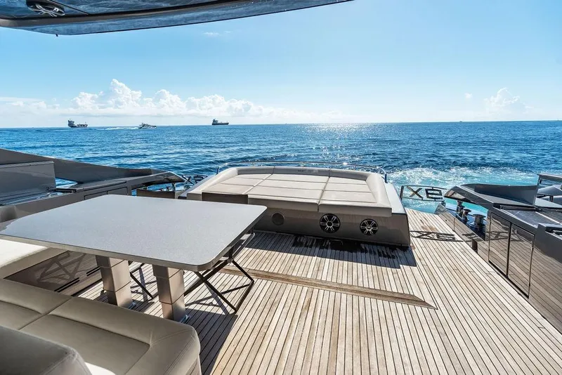 Slide: The Image of Luxurious 2019 Pershing 9X yacht deck with ocean view and elegant seating area. - 36