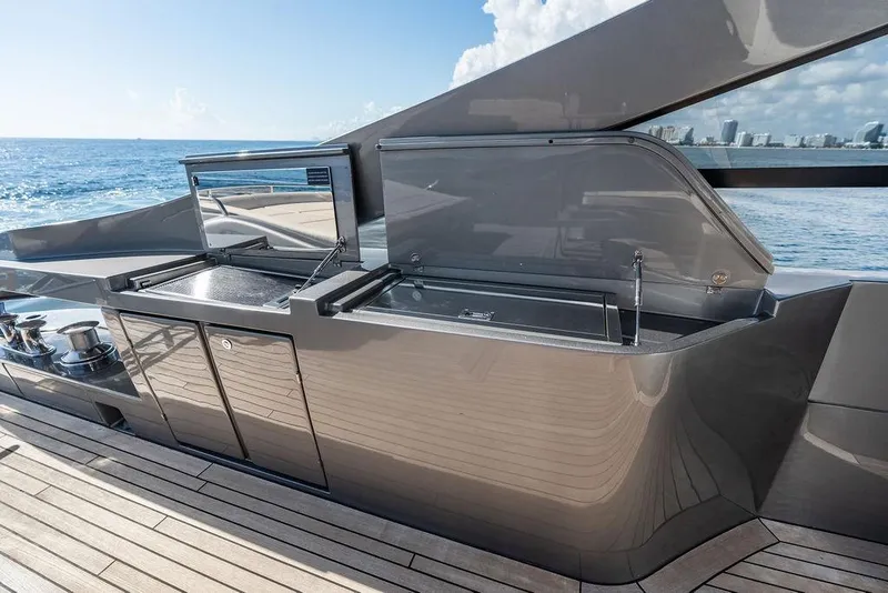 Slide: The Image of Luxury outdoor kitchen on 2019 Pershing 9X yacht, featuring sleek design and ocean view. - 41