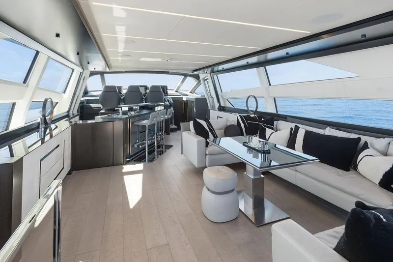 Slide: The Image of Luxurious interior of 2019 Pershing 9X yacht with modern seating and panoramic windows. - 43