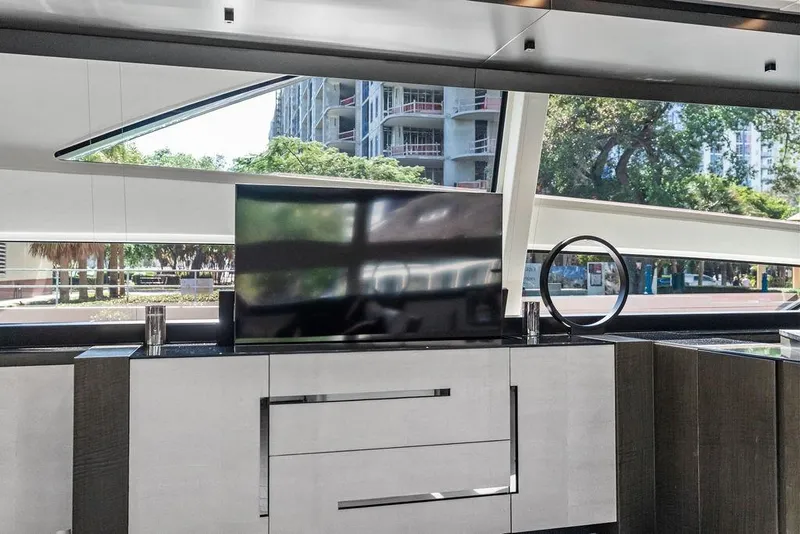 Slide: The Image of Luxurious interior of 2019 Pershing 9X yacht with modern TV and sleek design. - 45