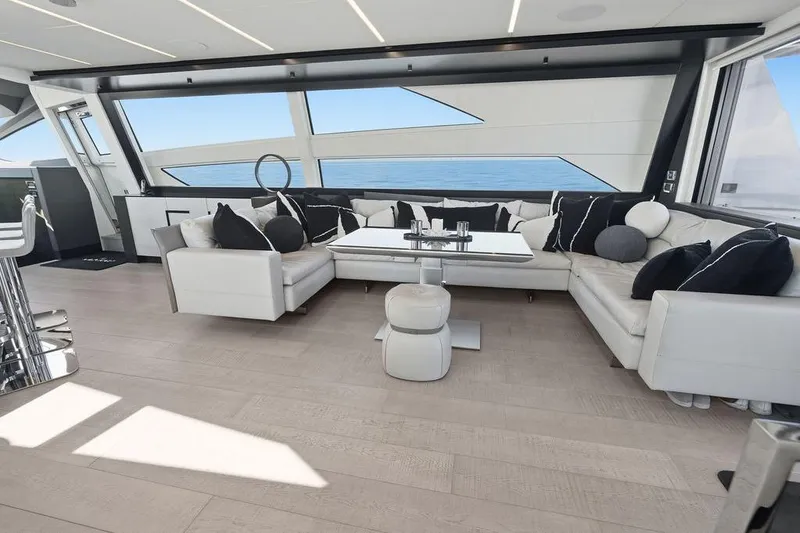 Slide: The Image of Luxurious interior of 2019 Pershing 9X yacht with modern seating and ocean view. - 46