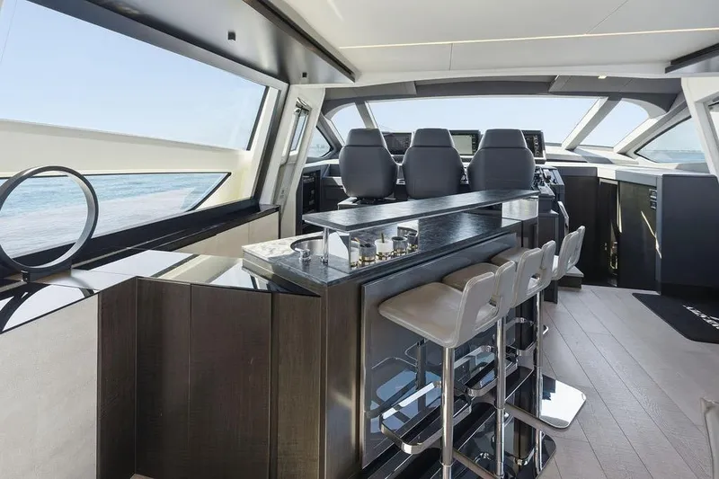 Slide: The Image of Luxurious interior of 2019 Pershing 9X yacht with modern seating and panoramic windows. - 47