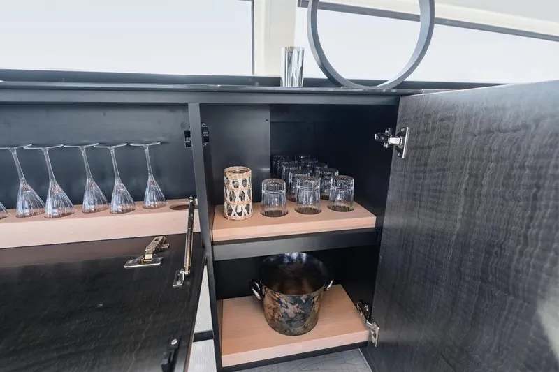 Slide: The Image of Luxury yacht Pershing 9X 2019 interior bar with glassware and ice bucket. - 48