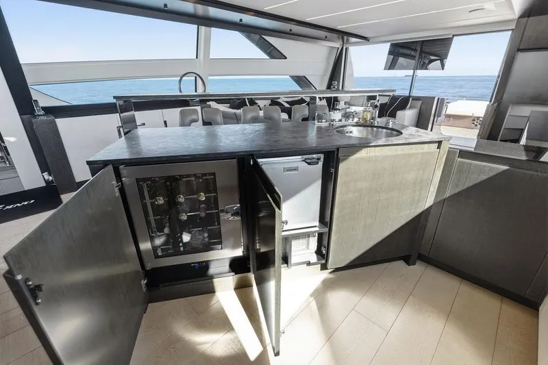 Slide: The Image of Luxurious 2019 Pershing 9X yacht interior with modern kitchen and ocean view. - 50
