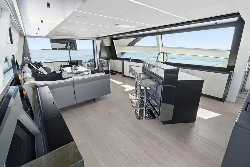 Slide: The Image of Luxurious interior of 2019 Pershing 9X yacht with modern seating and ocean view. - 54