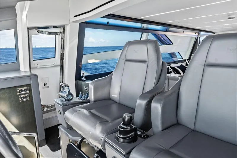 Slide: The Image of Luxurious interior of 2019 Pershing 9X yacht with leather seating and ocean view. - 58